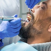 a man having his teeth cleaned by a dentist
