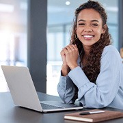 Woman smiling while working in office